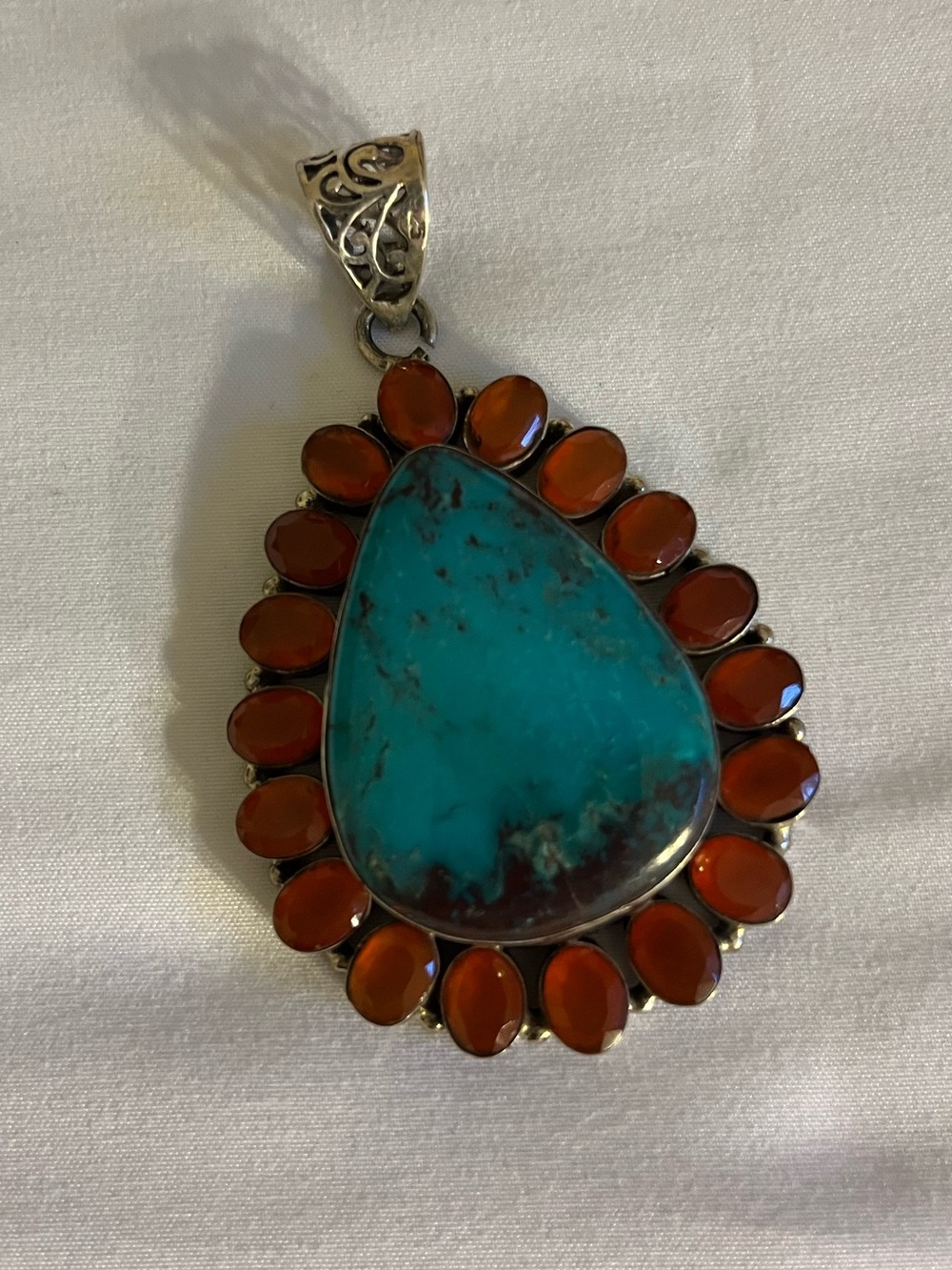 Sterling Silver Turquoise Teardrop Pendant with Carnelian Halo